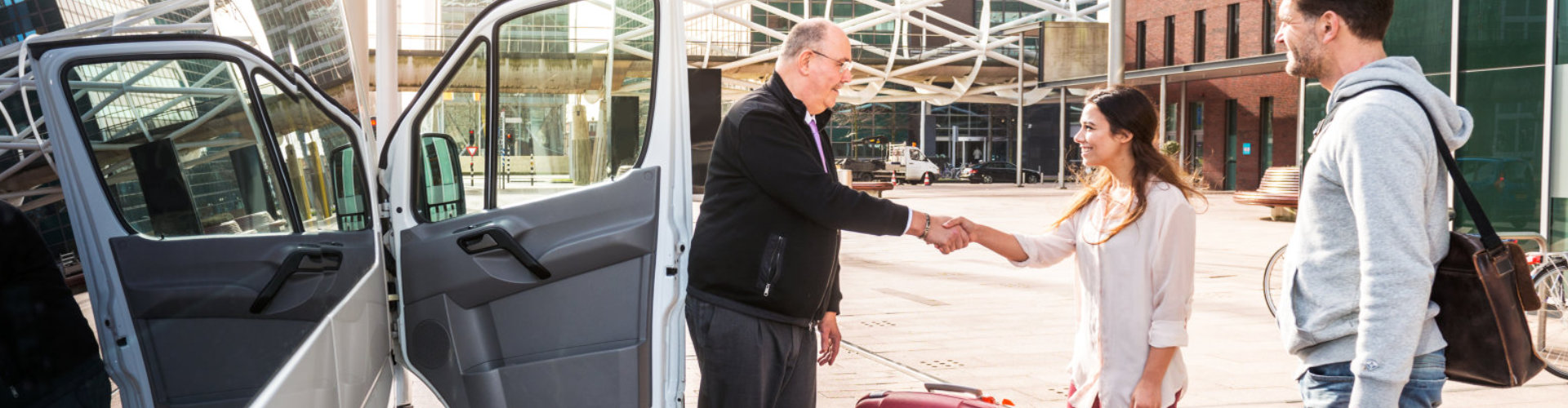 driver shaking hands with his passenger